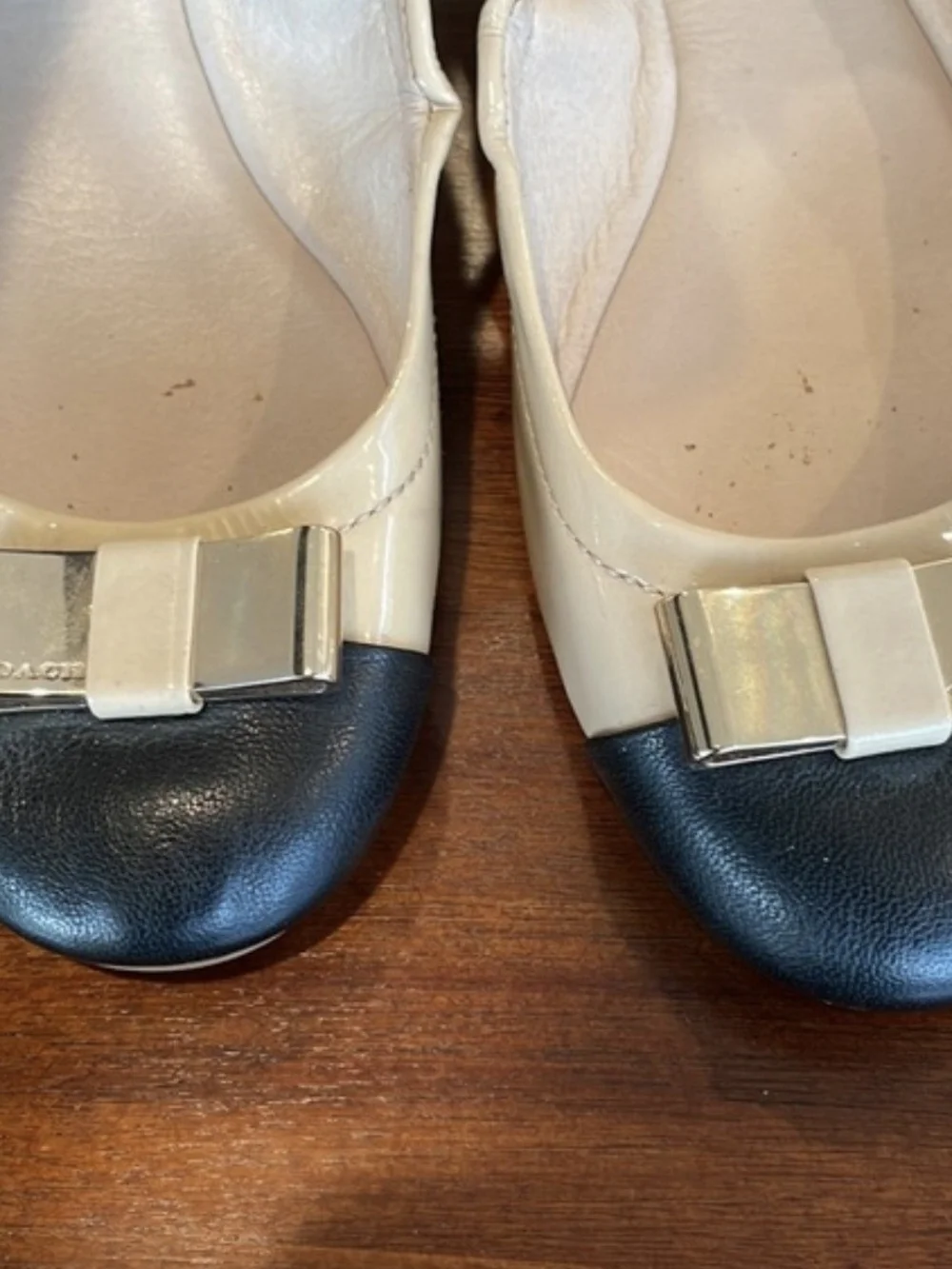 Coach Two-Tone Patent Bow Cap-Toe Ballet Flats in Beige and Black